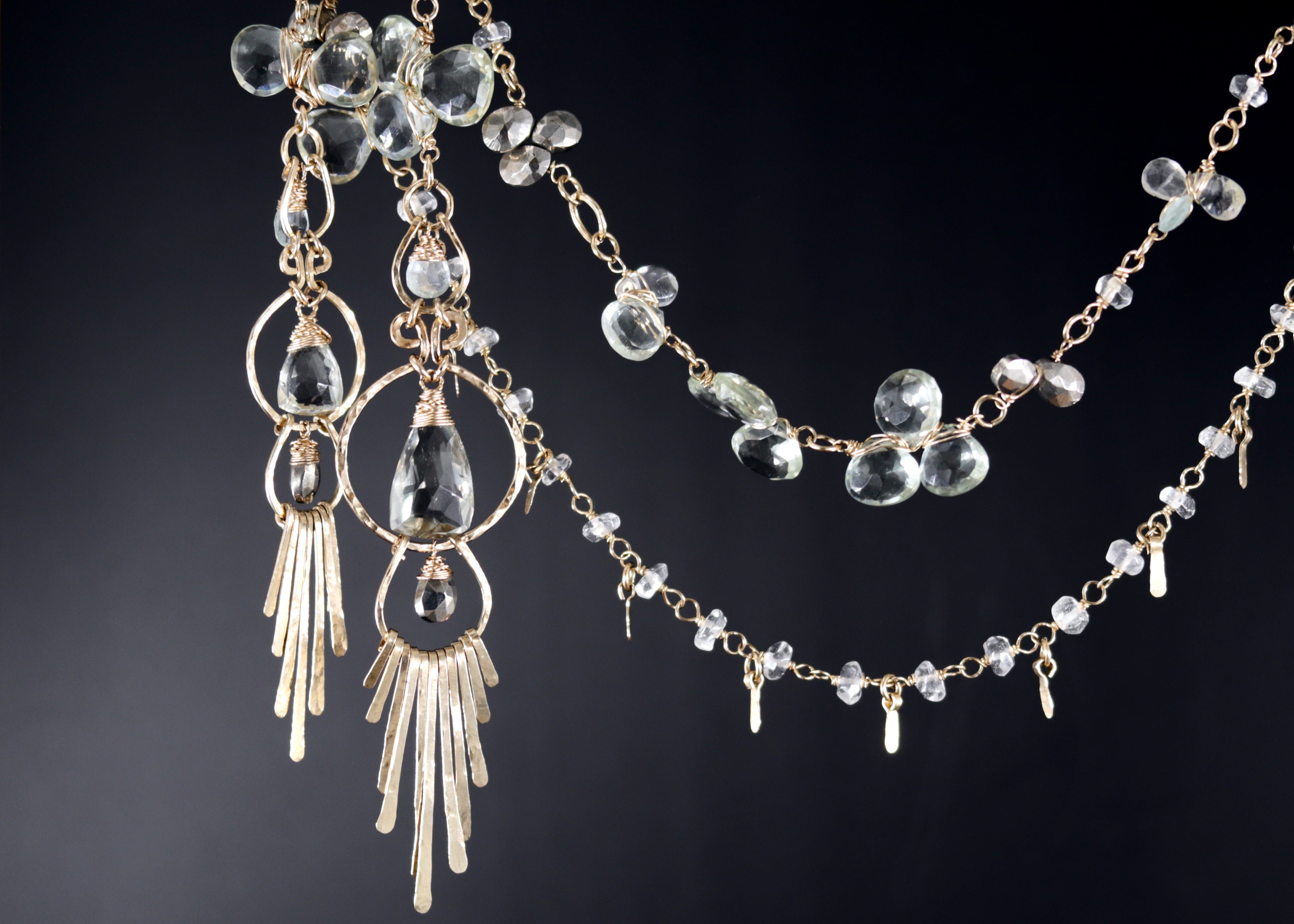 a collection of elegant jewelry pieces, including earrings and necklaces, with a focus on the intricate designs and sparkling crystal elements.