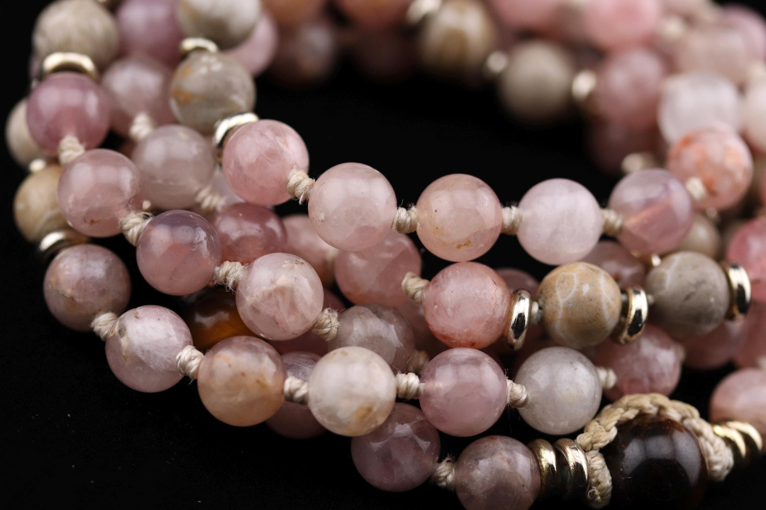 A close-up image of a collection of beaded jewelry, including necklaces and bracelets, with a variety of colors and sizes.